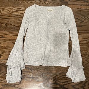 Chaser gray top with bell ruffle sleeves